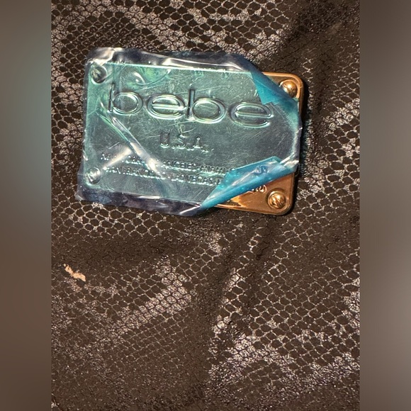 Like new Bebe black snack print tote/ shoulder bag with gold chain straps - Picture 8 of 14